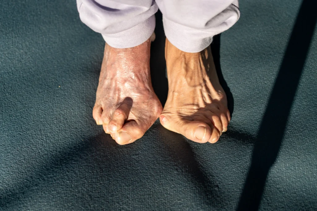 close up of feet on blue yoga mat 2026 03 16 04 29 35 utc